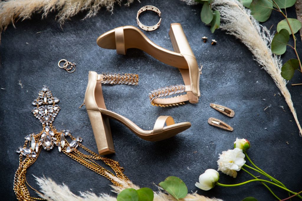 Shoes, jewelry, and flowers from an elopement