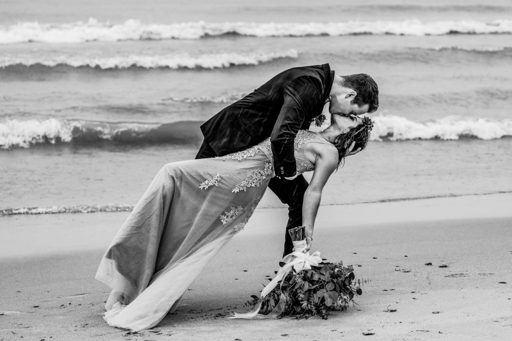 Now engaged, the couple poses for portraits after their surprise proposal on the coast of Wisconsin